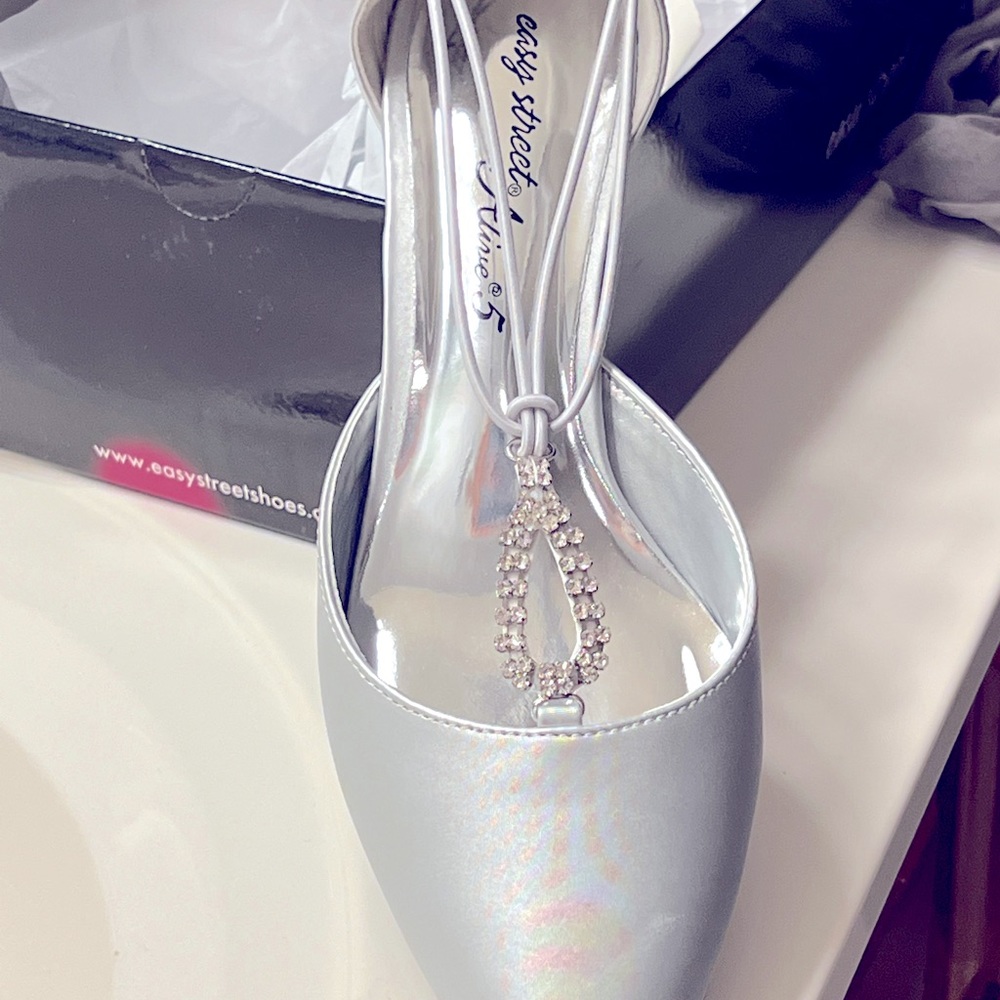 Beautiful white satin evening shoes.